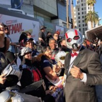 Bob Layton signs autographs for the Ant-Man and the Wasp cos-players at the red carpet premiere.