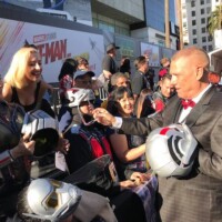Bob Layton signs autographs for the Ant-Man and the Wasp cos-players at the red carpet premiere.