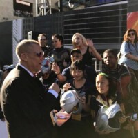 Bob Layton signs autographs for the Ant-Man and the Wasp cos-players at the red carpet premiere.